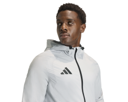 ADIDAS TIRO TRAVEL WINDBREAKER - TMLGGR/BLACK
